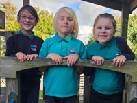 four children in school garden